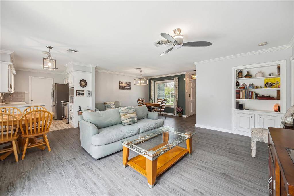 Built-ins add style and storage in the spacious living room, with ample room for relaxing or entertaining.