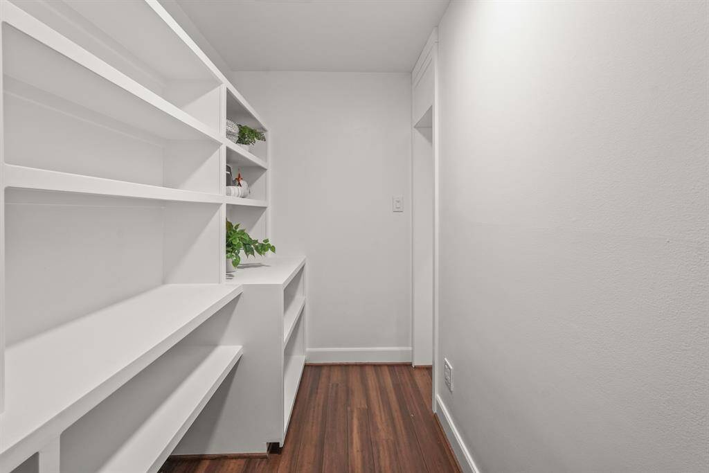 This spacious Pantry is a standout feature, with built-in shelves that provide generous storage space for all your kitchen necessities.