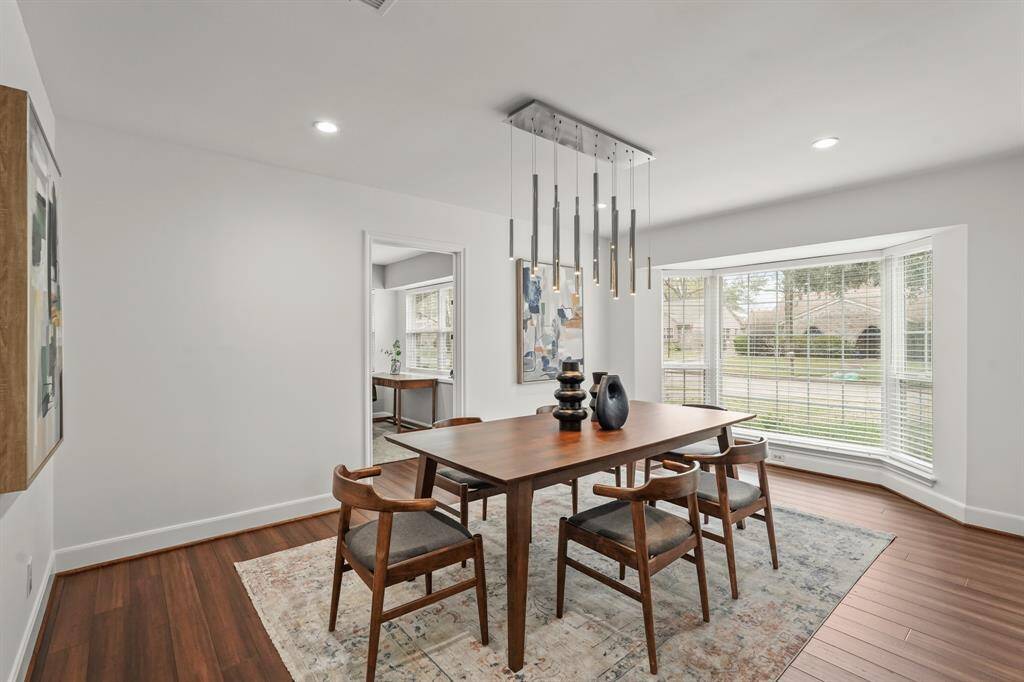 Step into the bright & stylish Dining Room, where a stunning modern chandelier provides a focal point & enhances the room’s contemporary charm. This inviting space is perfect for meals & special occasions.