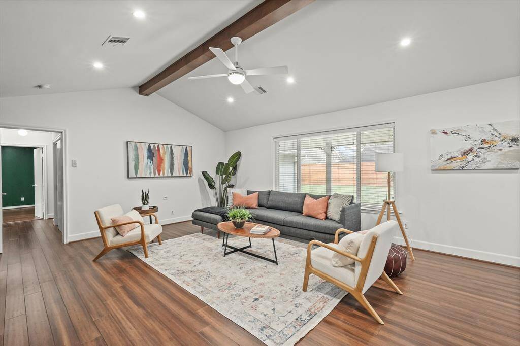 The expansive layout of the Family Room offers plenty of room for relaxation & entertainment, making it an ideal gathering spot. The ceiling was raised and the wood beam added for a custom feel. LED canned lighting was added. Home features double pane windows.