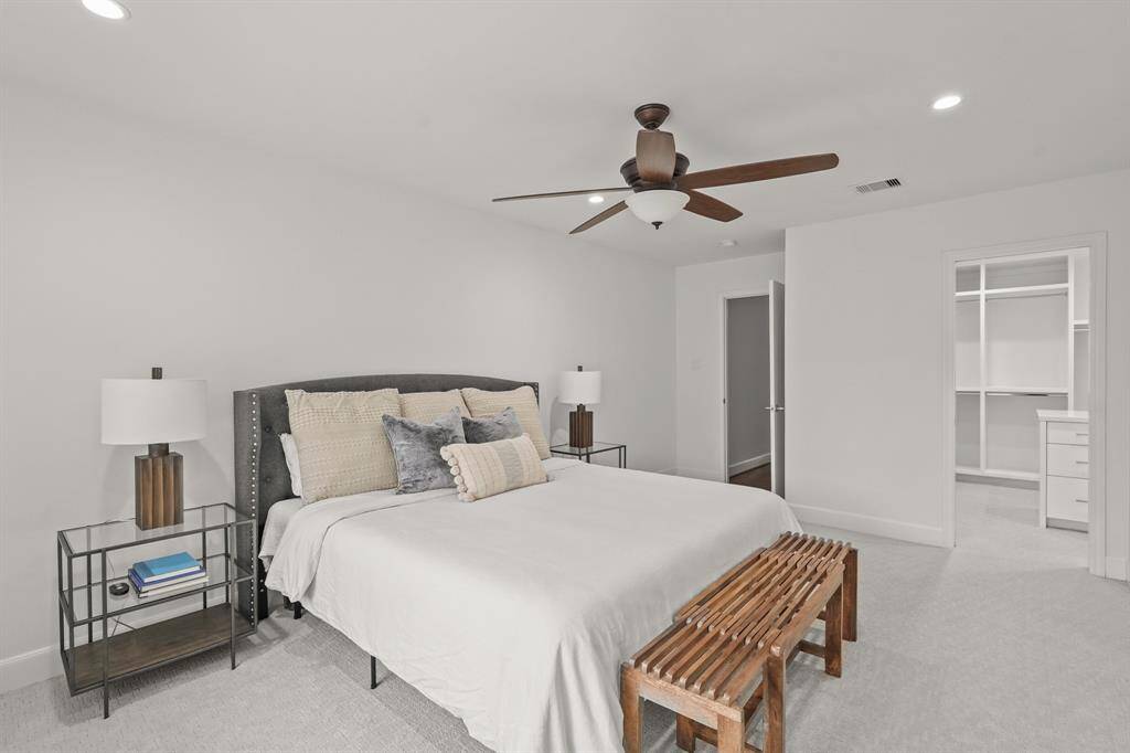 Primary Bedroom is a true retreat, featuring updated carpet, a huge custom walk-in closet & luxurious En Suite Bathroom.