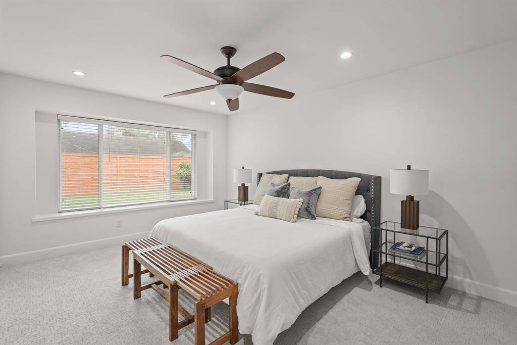 Primary Suite has large windows providing lovely views of the yard & offers a generous layout, perfect for relaxation.