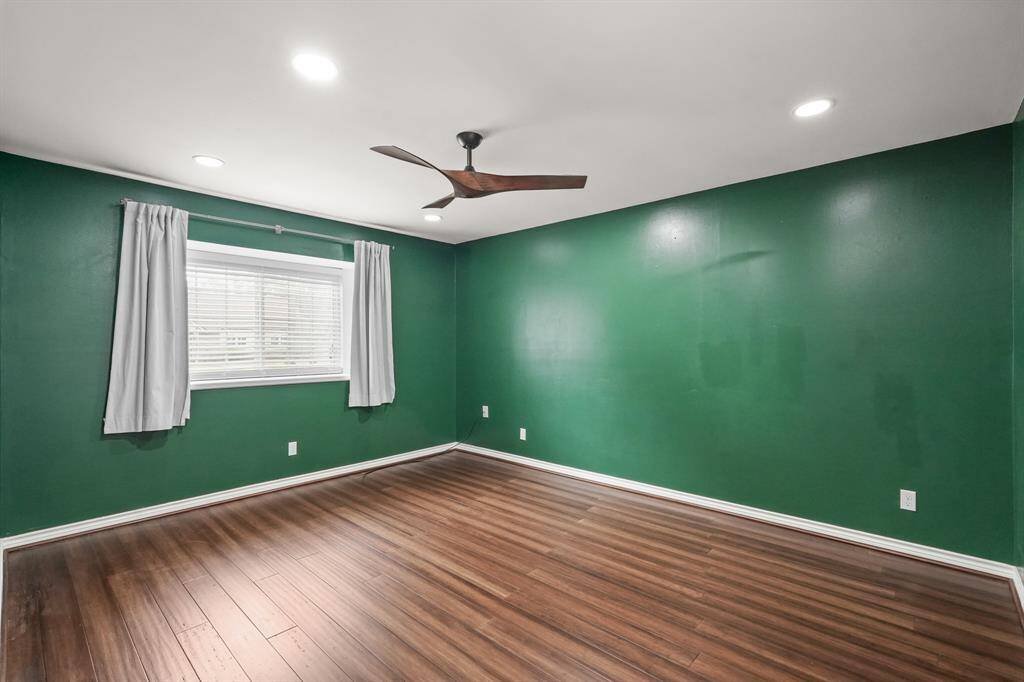 Bedroom #3 offers a modern ceiling fan to keep cool, & has plenty of room for various furniture arrangements.