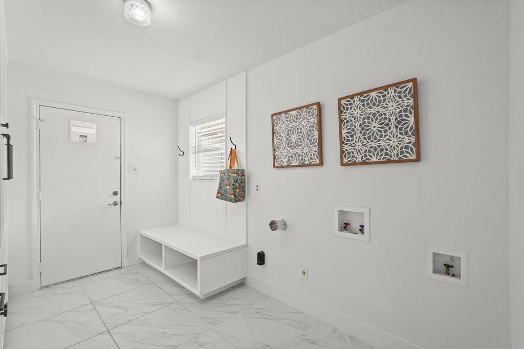 The Utility Room's generous size ensures plenty of room for all your needs, while the built-ins keep everything neatly organized & easily accessible.