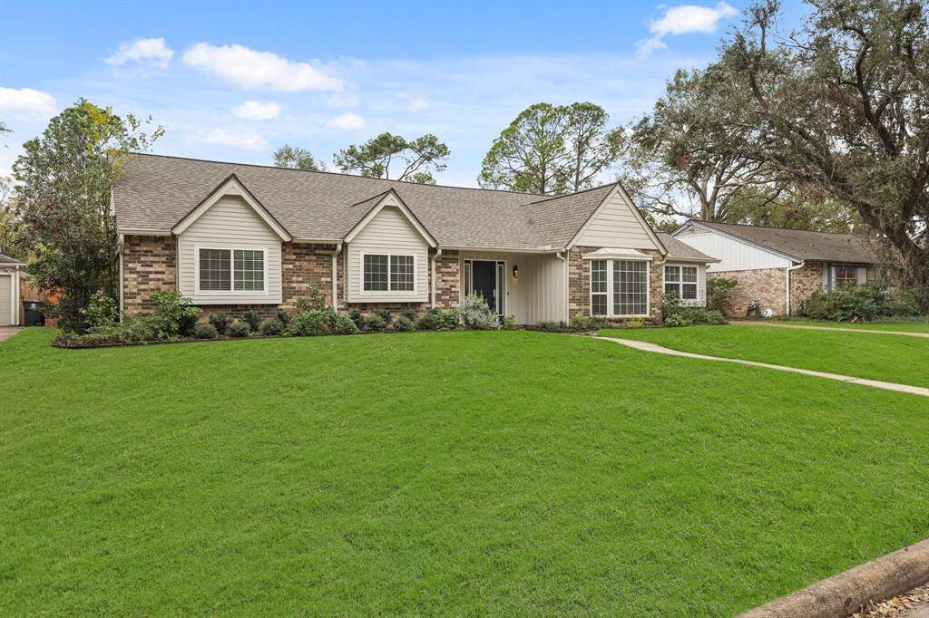 The front yard is neatly manicured, and highlights the home’s charming exterior.
