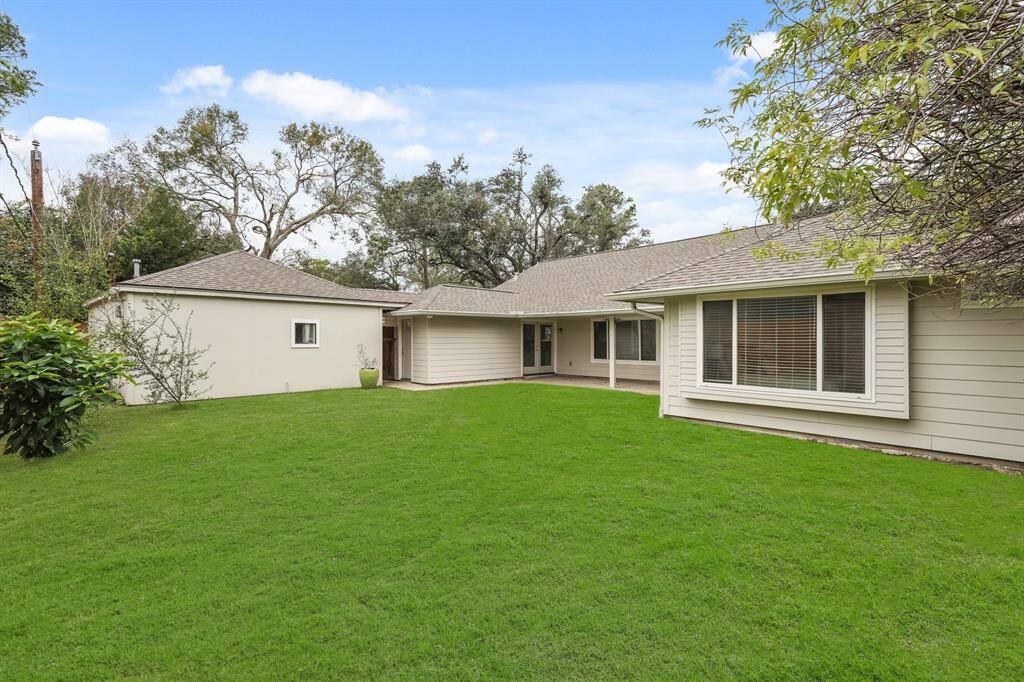 The backyard is ideal for gardening, outdoor activities, or enjoying time with family & friends.