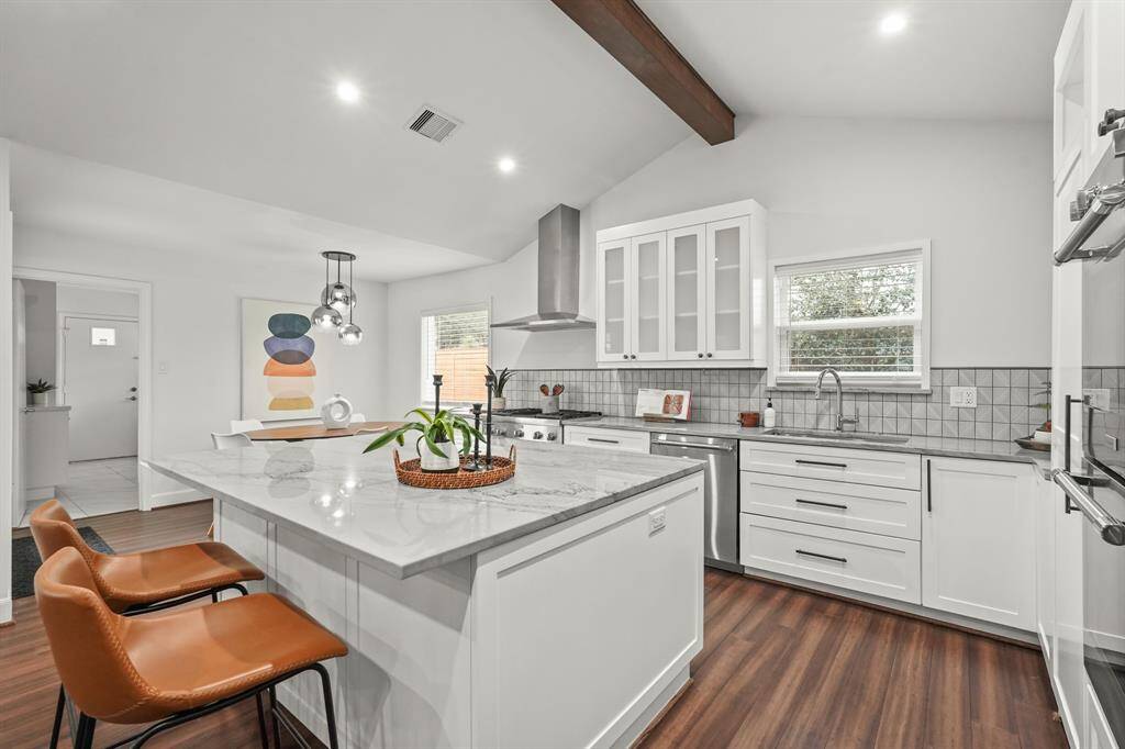 The Kitchen offers a perfect balance of style & convenience for everyday living or hosting guests. The cabinets have recntly been updated with glass front cabinets and easy close drawers.