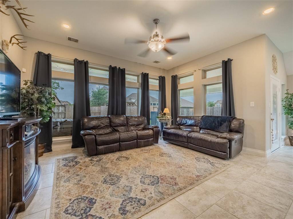 Living room is very open double wall of windows lets in lots of natural light