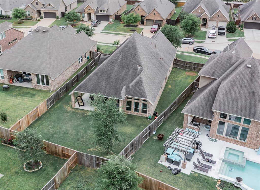 this aerial shows the back of your home and the large backyard