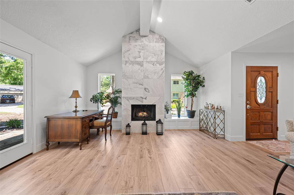 A stunning fire place gives luxurious ambiance to the living space.