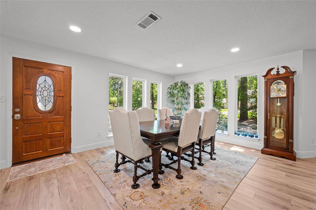 Dining room with gorgeous picture windows.