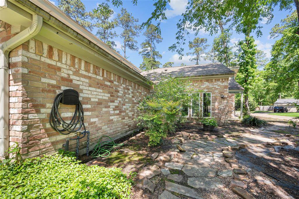 Charming stone path from driveway/garage to front door!