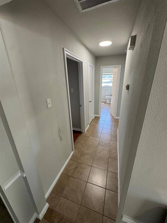 Hallway to bedrooms and bathroom
