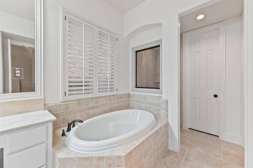 Primary bathroom with separate tub
