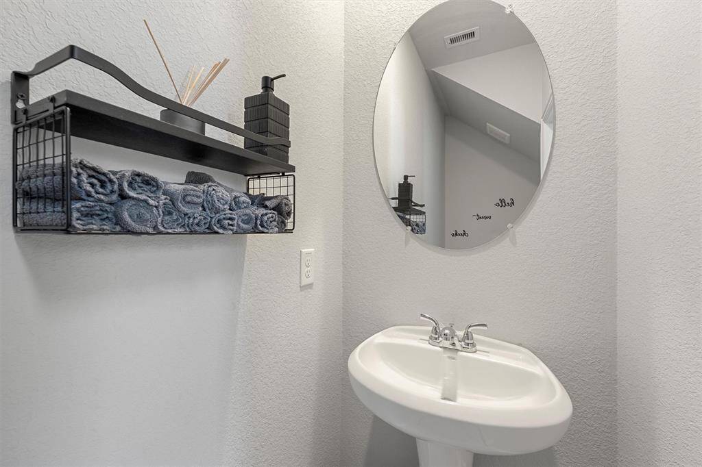 Convenient downstairs half bath for guests.