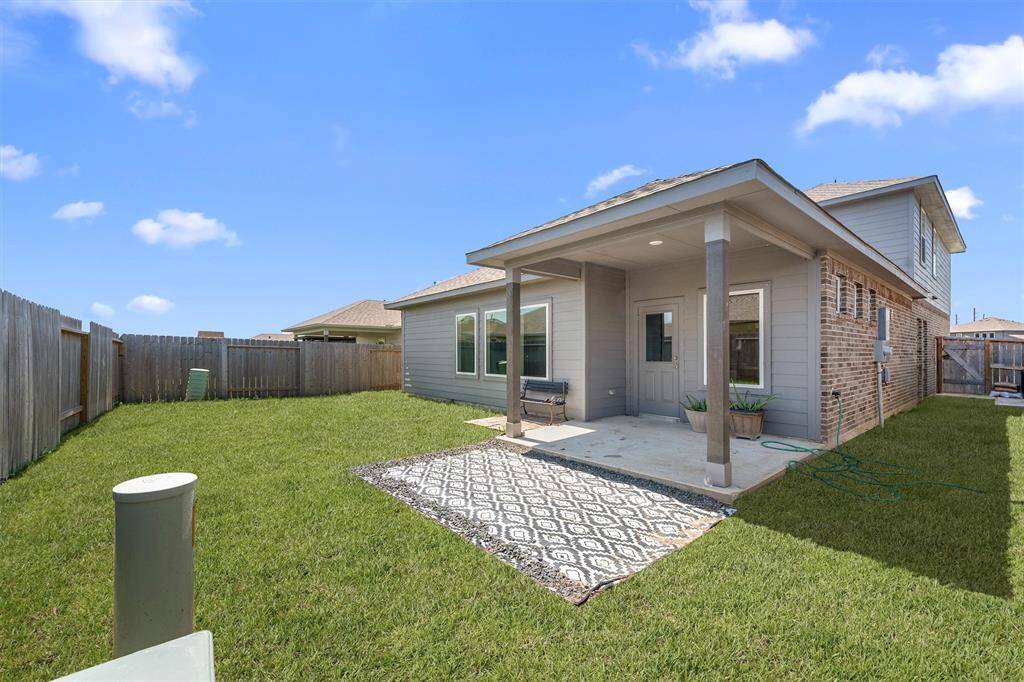 Low-maintenance backyard with just the right amount of space for pets, play, or a garden retreat—easy to enjoy without all the upkeep.