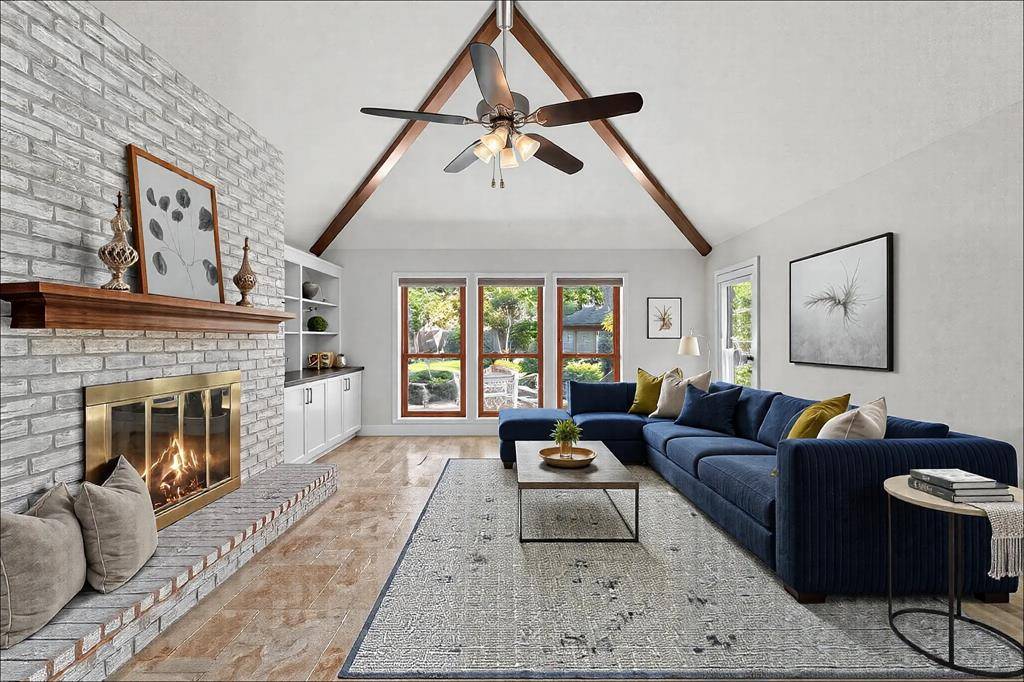 Vaulted ceiling with large picture windows tha look over park like backyard!