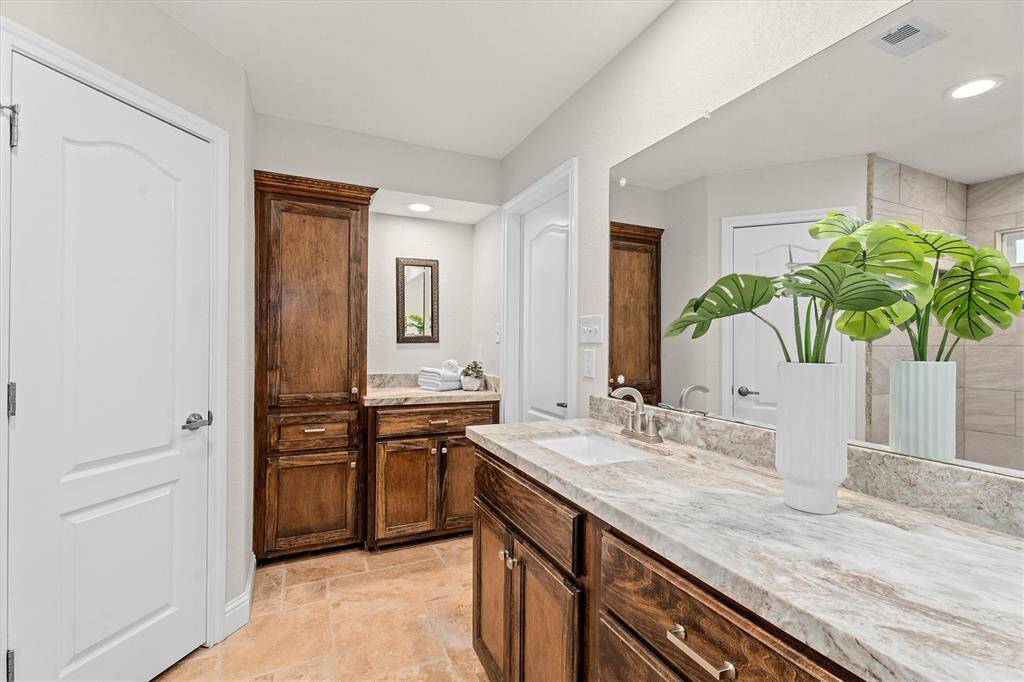Primary bath with Natural Marble countertops