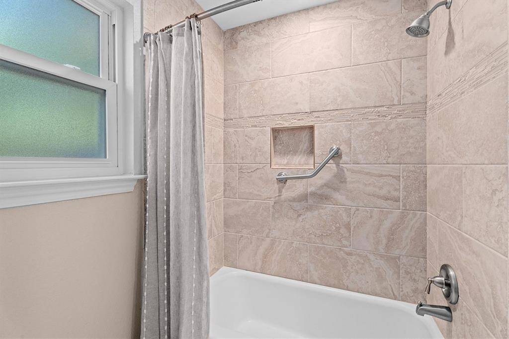 Secondary Bathroom Tub/Shower with upgraded tile surround