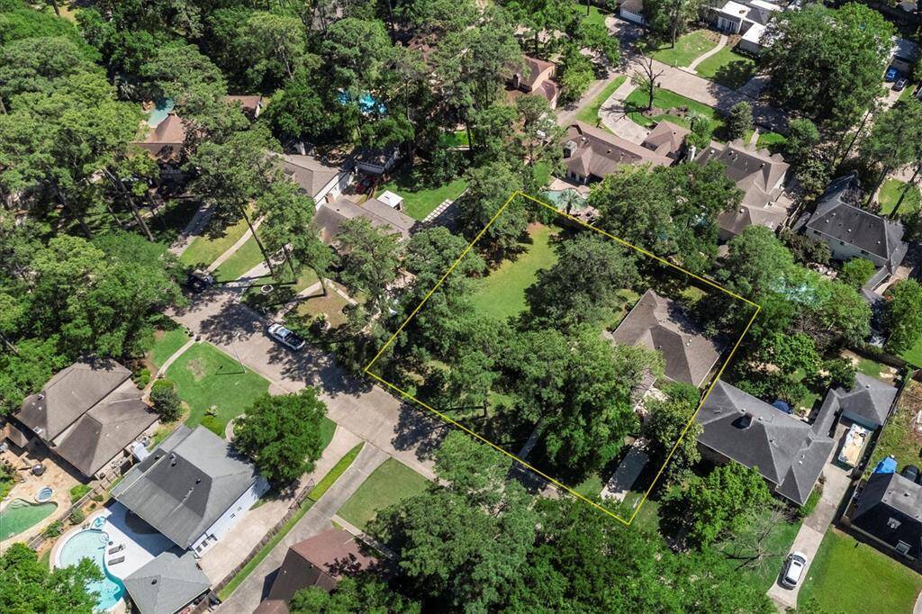 Aerial view of this amazing wooded lot on almost one half acre