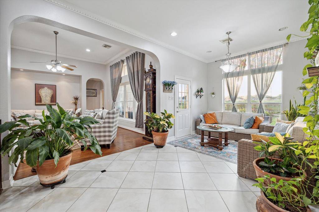 From the kitchen looking to the beautiful breakfast area, stunning golf course views, and the den.