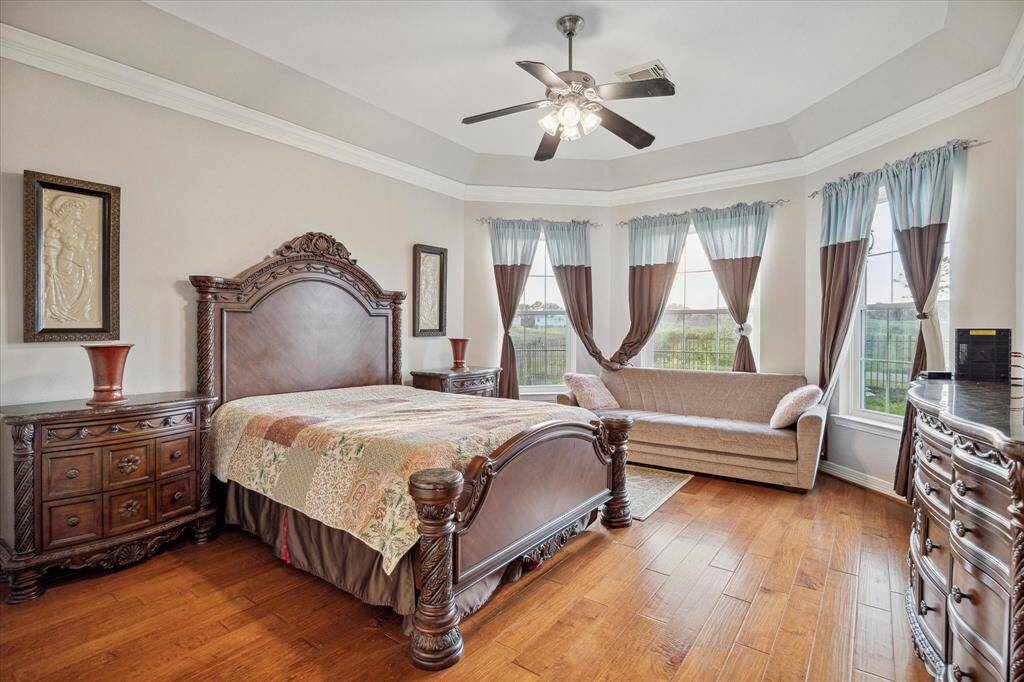 The elegance and charm continue into your huge Owner's Retreat, complete with vaulted ceilings, engineered wood flooring, crown molding, a sitting area... and THOSE VIEWS!