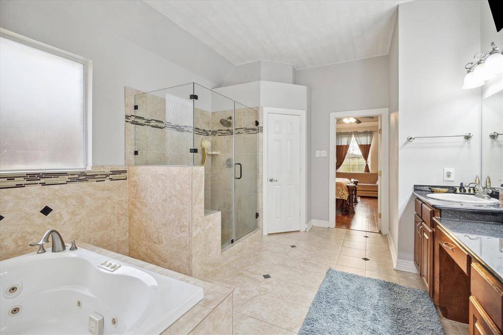 With a jetted tub, large separate shower, double sinks, vanity area, and a walk in closet, I really can't think of anything that is left to be desired here.