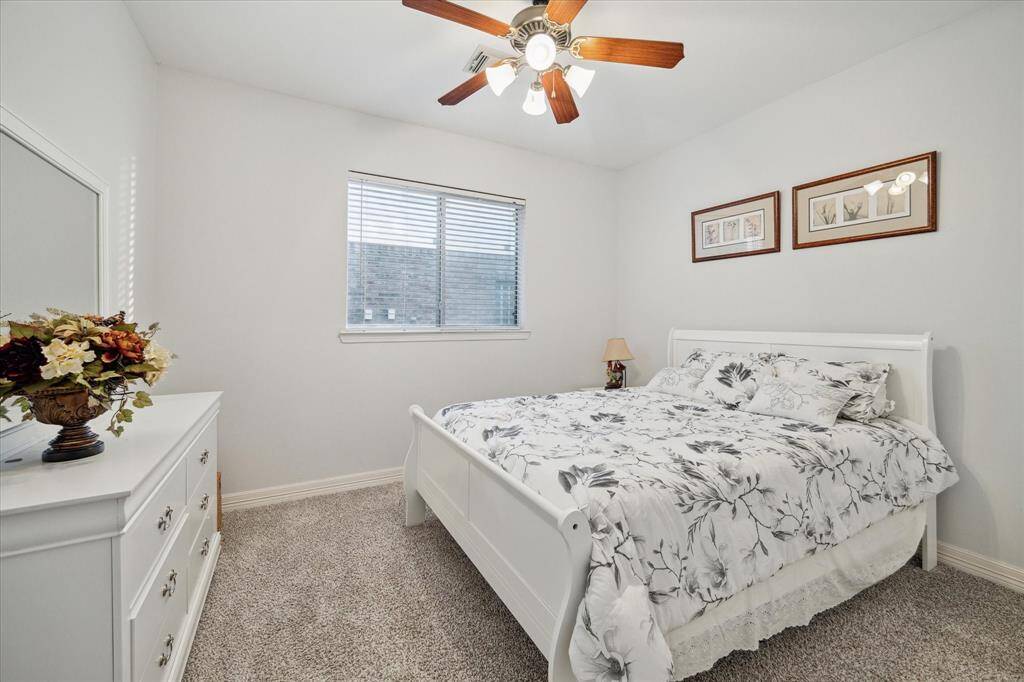 Guest bedroom three. All of them have ceiling fans for comfort.