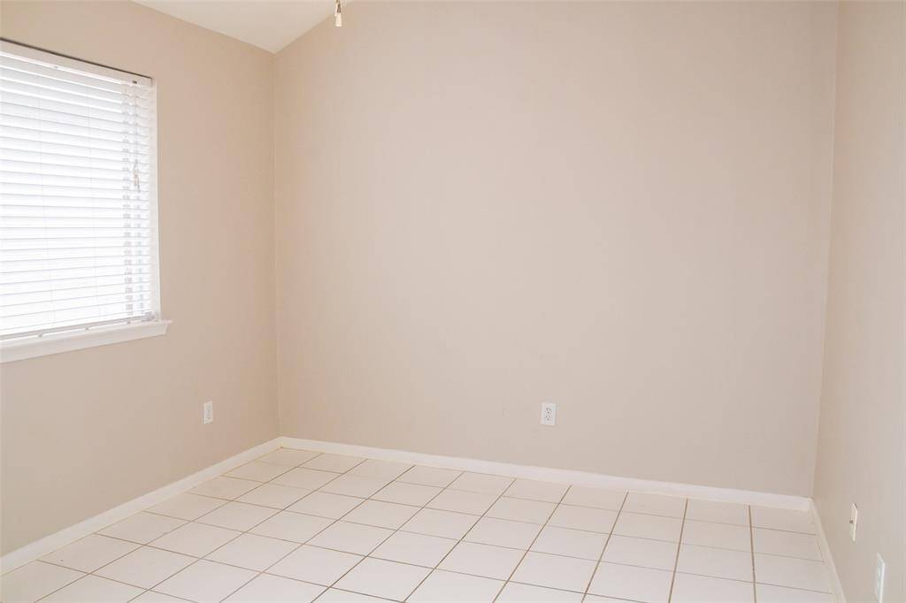 Third bedroom with tile could be used for play room or craft room.