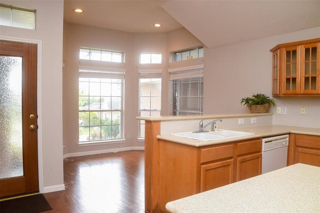 Recently refinished wood floors are ready for your furniture. Nice stone county tops.