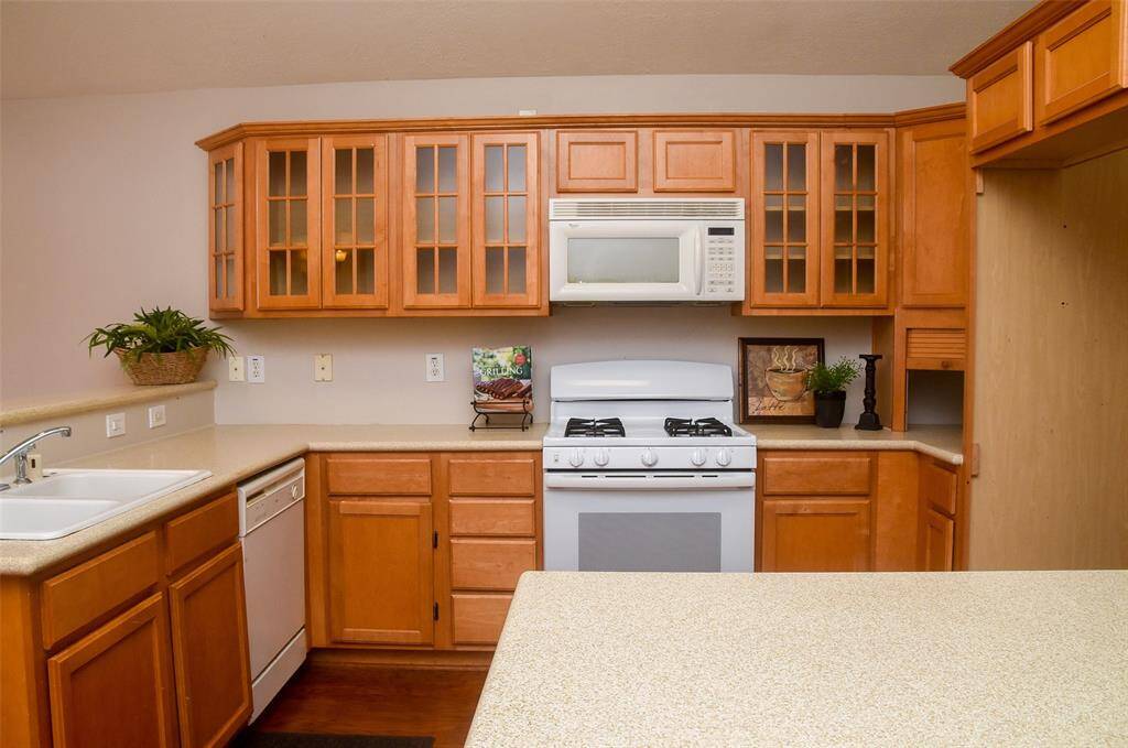 Notice the beautiful cabinets and gas stove fro cooking.