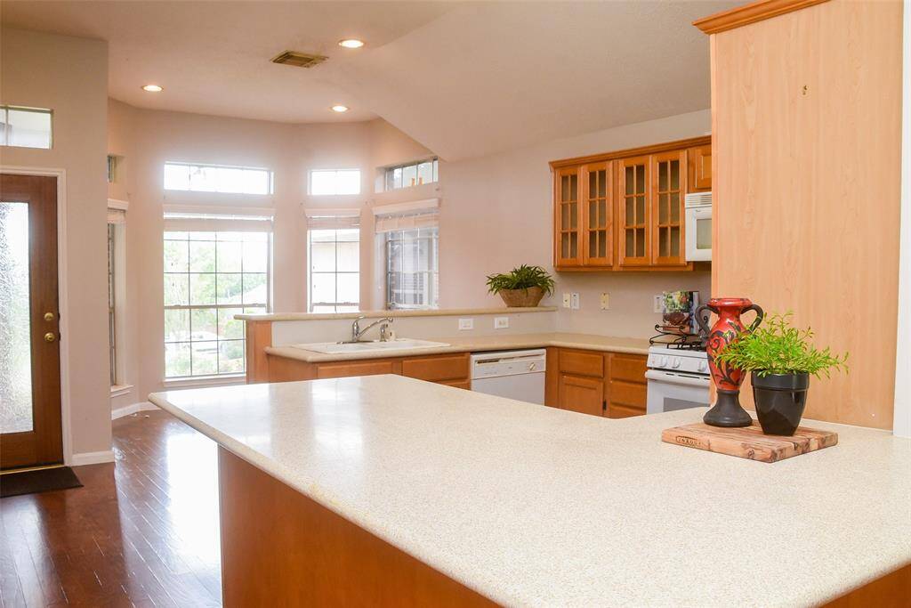 Another view of the kitchen and snack bar area.