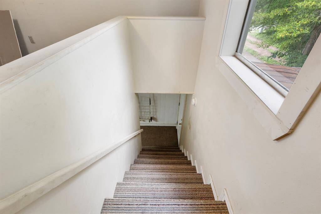 Stairs leading up to the second floor of the shop
