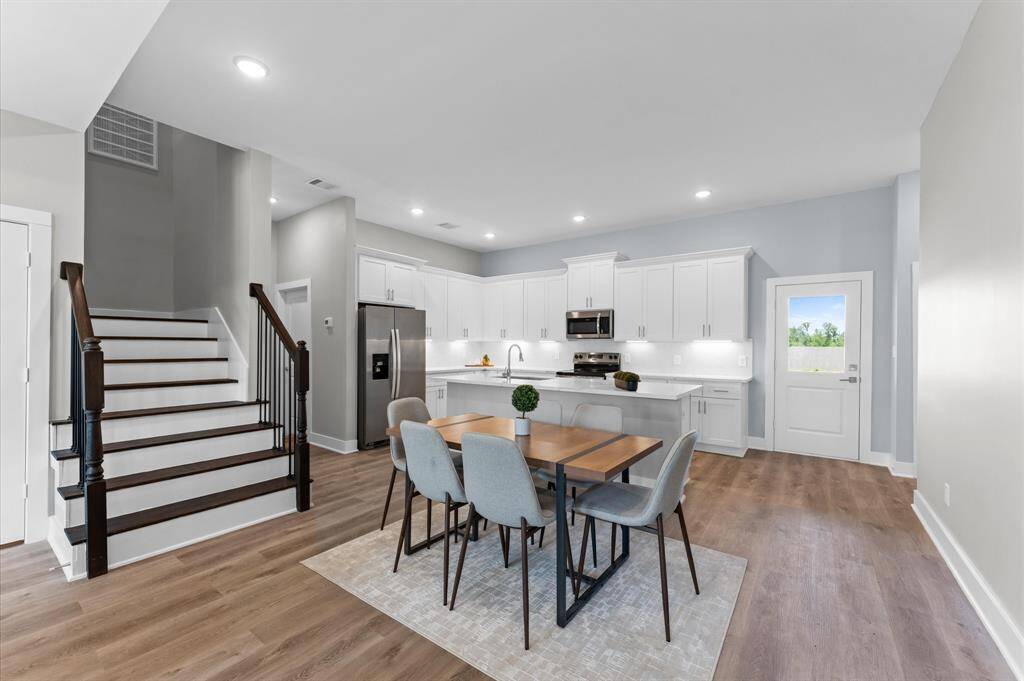 Dining area filled with natural light and open to the kitchen and living room