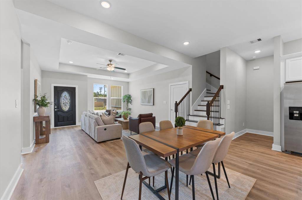 Dining area filled with natural light and open to the kitchen and living room