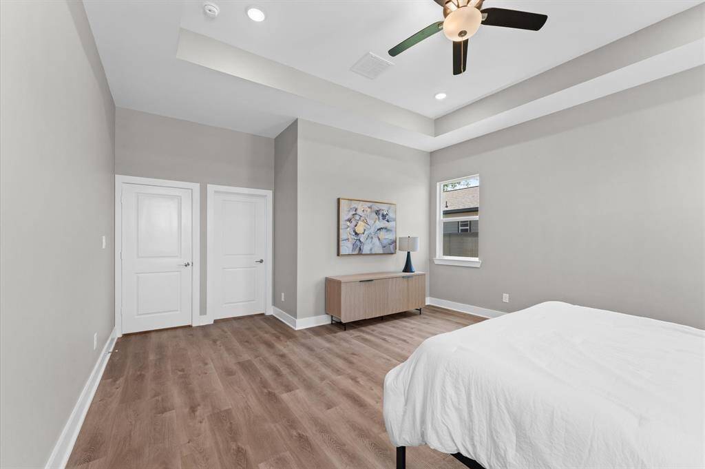 Oversized primary suite with room for a sitting area and tons of natural light.