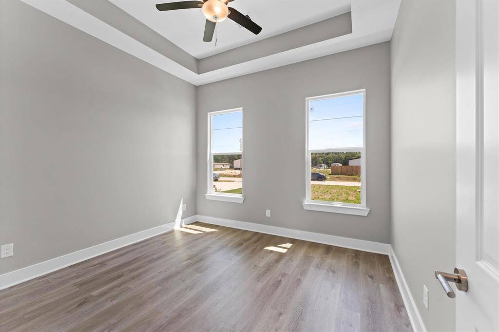 Second bedroom with modern finishes and no carpet.