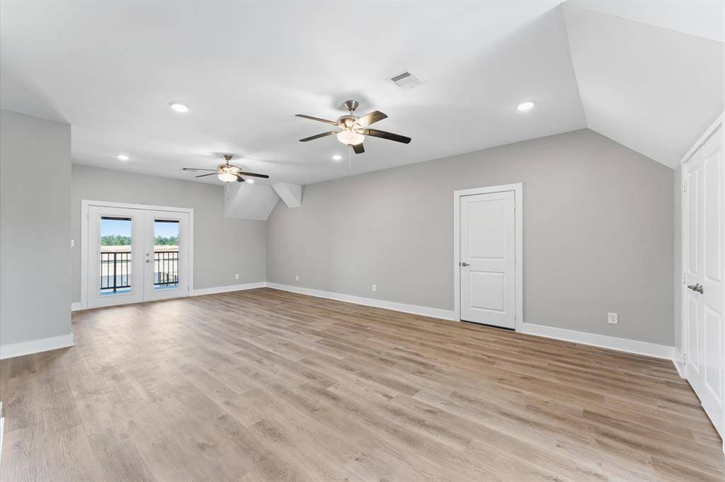 Massive game room upstairs with balcony access and room to entertain.