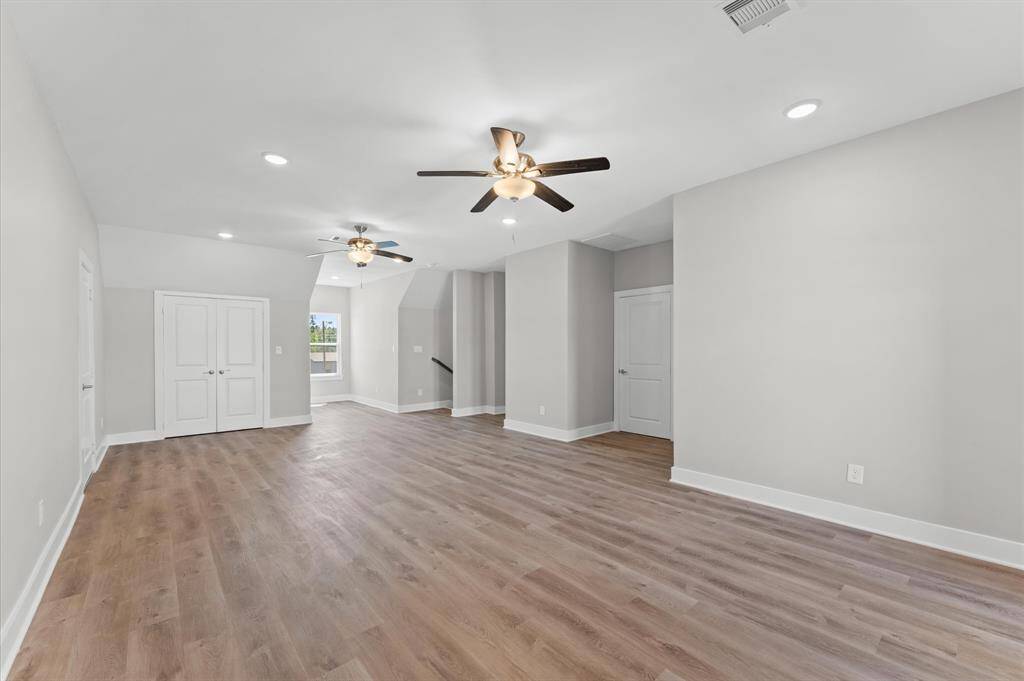 Massive game room upstairs with balcony access and room to entertain.