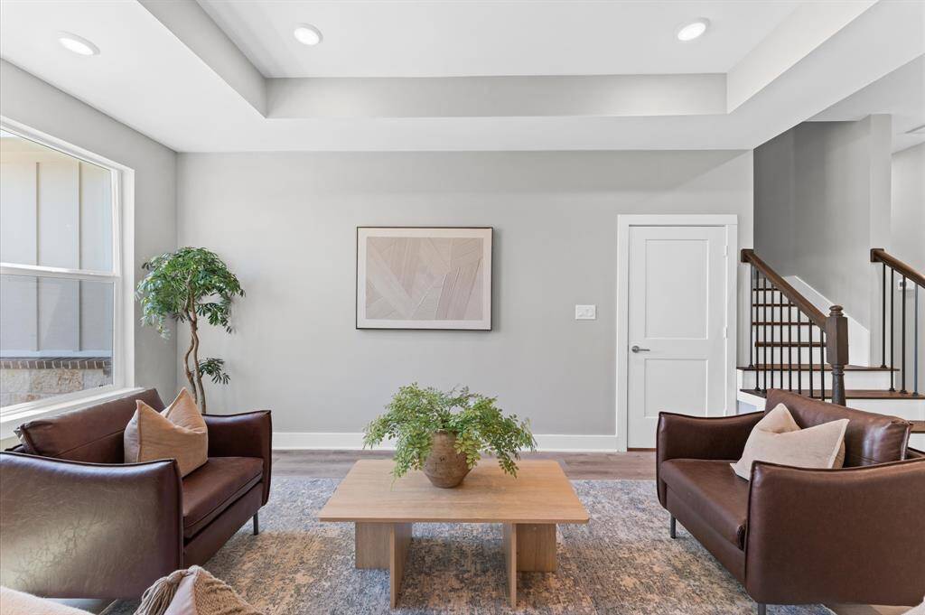 The heart of the home boasts an open layout with LED lighting throughout