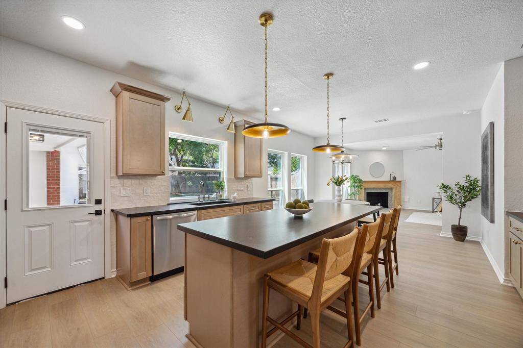 New stainless appliances and modern fixtures stand out in the beautiful kitchen.