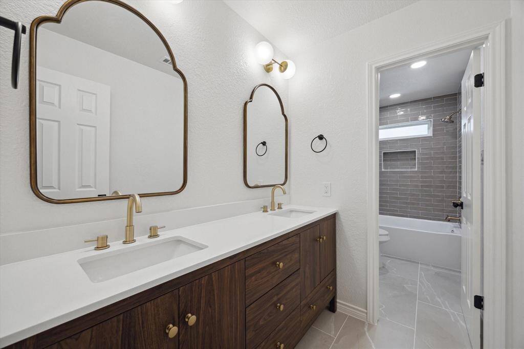 The hallbath has its share of upgrades as well - gorgeous vanity, beautiful tilework in the shower, and all new finishes.