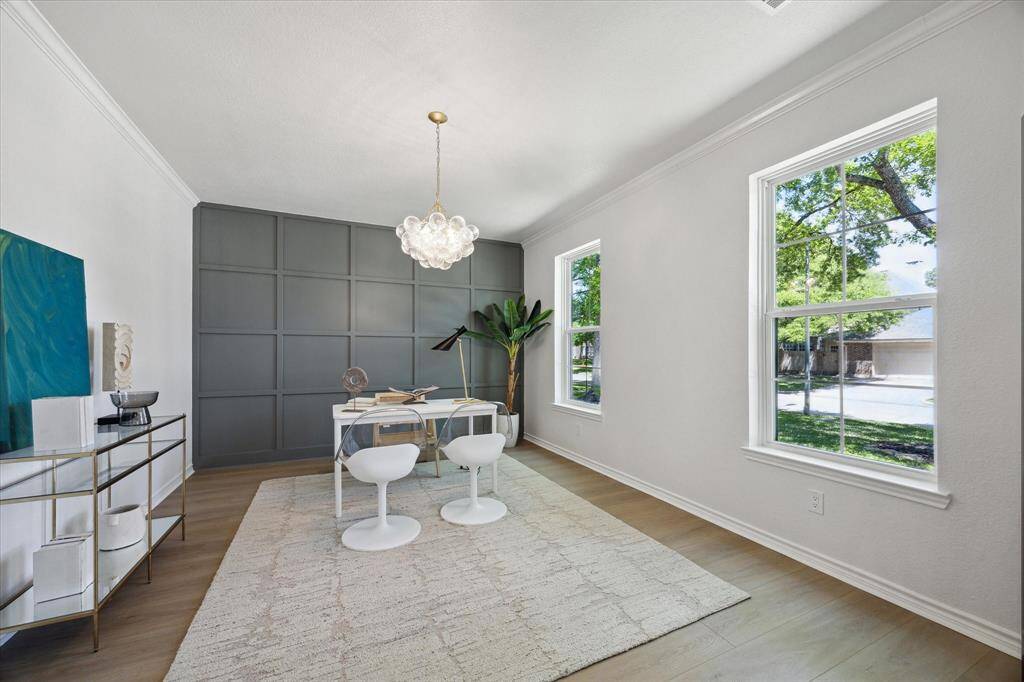 The office is a perfect work-from-home solution with new bold paint and custom paneling.