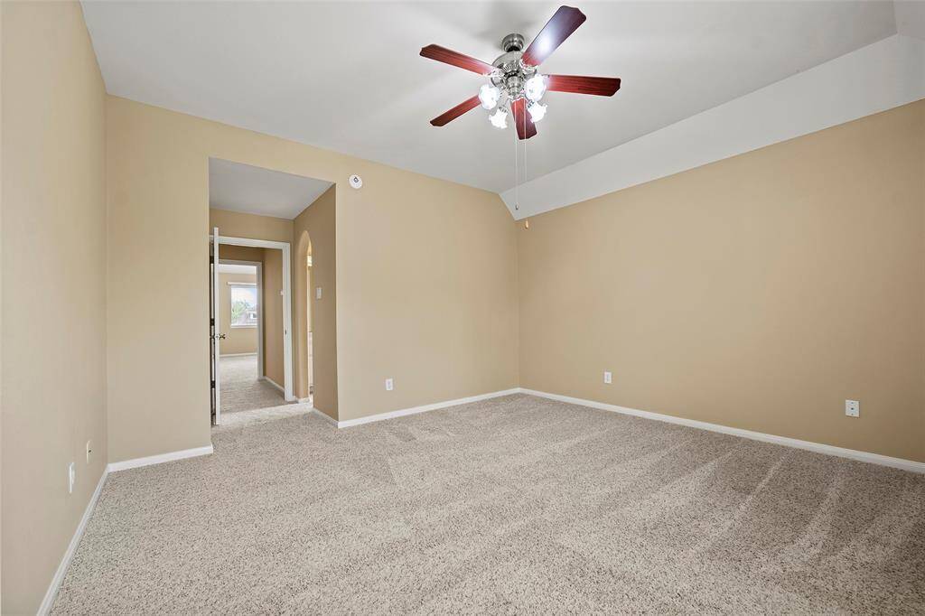 Inviting secondary bedroom with convenient Jack and Jill bathroom, connecting to an adjacent bedroom for easy access.