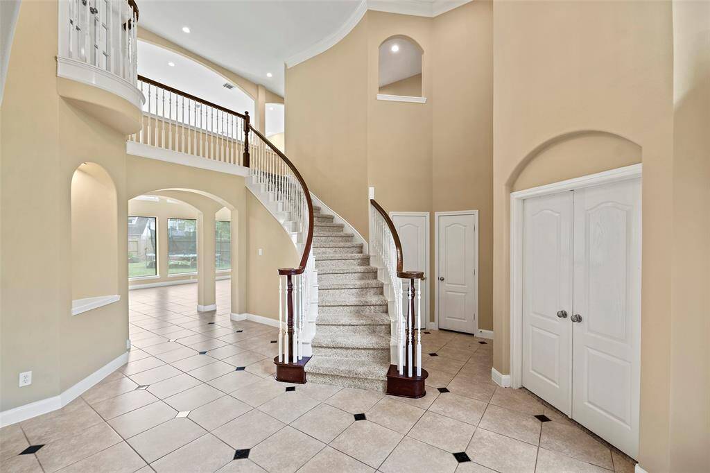 Elegant and inviting, the grand staircase offers a timeless charm reminiscent of a romantic era.