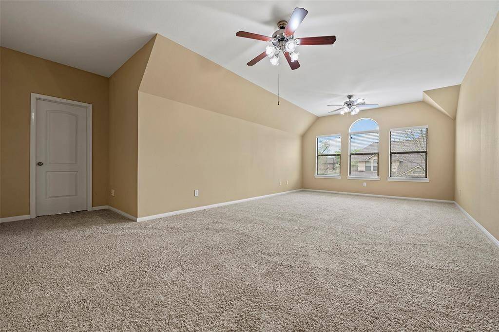 Another view of the spacious second-floor game room, perfect for entertainment and relaxation.