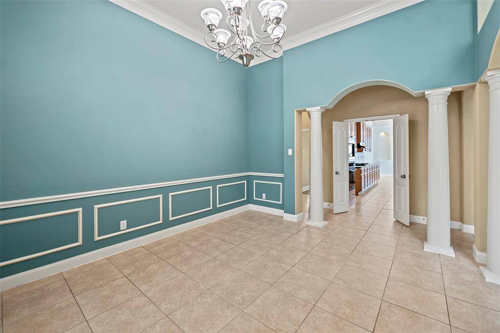 Elegant formal dining room located conveniently across from the kitchen.