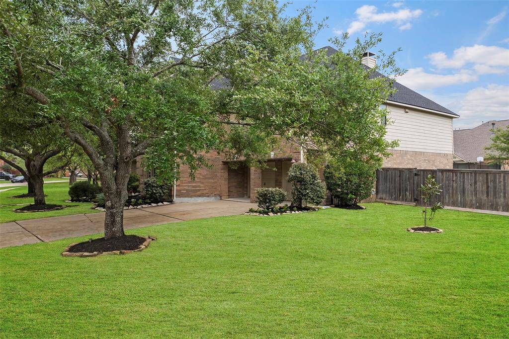 This charming home features a brick exterior and has a wooden fence ensuring backyard privacy.