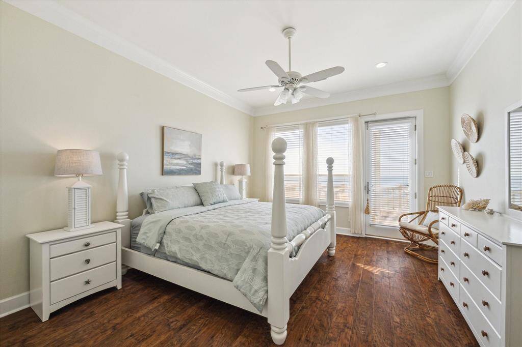 Imagine waking up here! Primary main floor bedroom with a stunning view and access to main floor balcony!