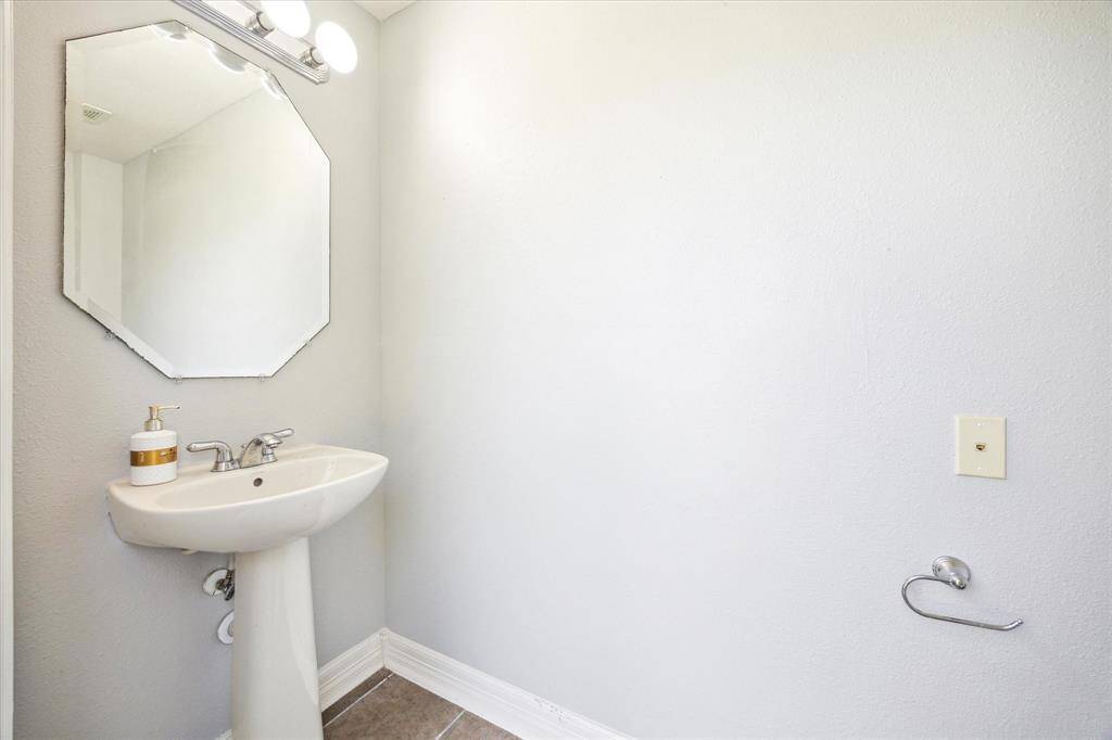 Convenient second powder bath w pedestal sink next to backyard
